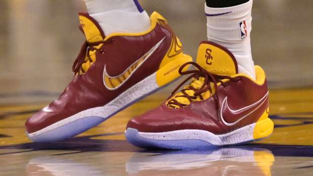 LeBron James' cardinal and gold Nike sneakers.